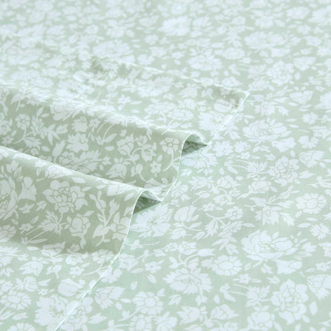 Bed setup with Laura Ashley heirloom-ditzy-green sheets for timeless elegance