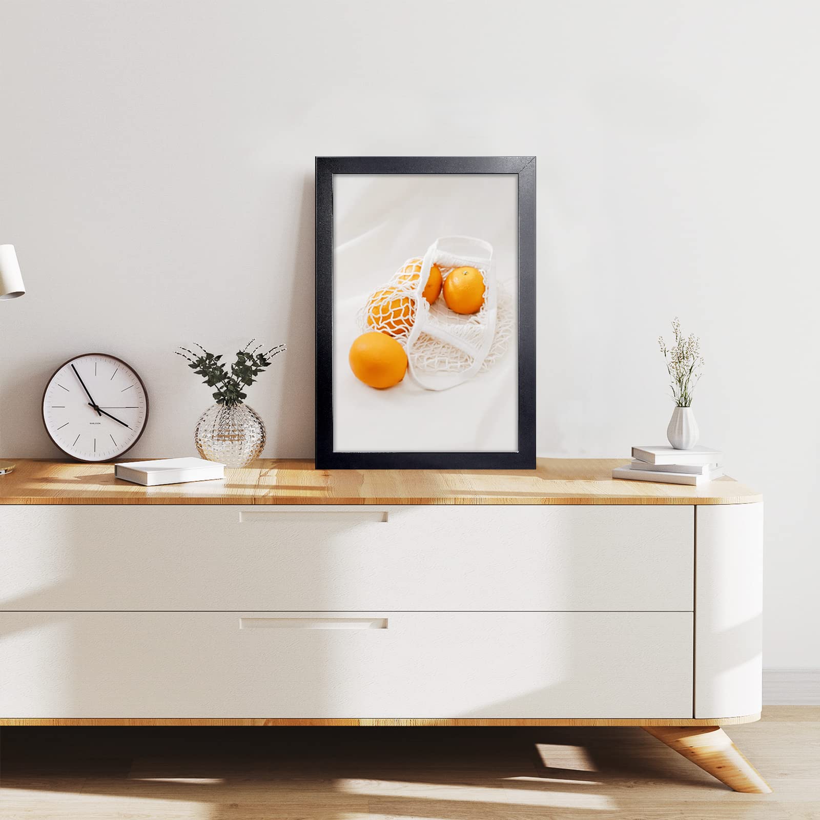 LaVie Home frame mounted on a wall in a living room setup for decor.