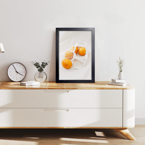 LaVie Home frame mounted on a wall in a living room setup for decor.