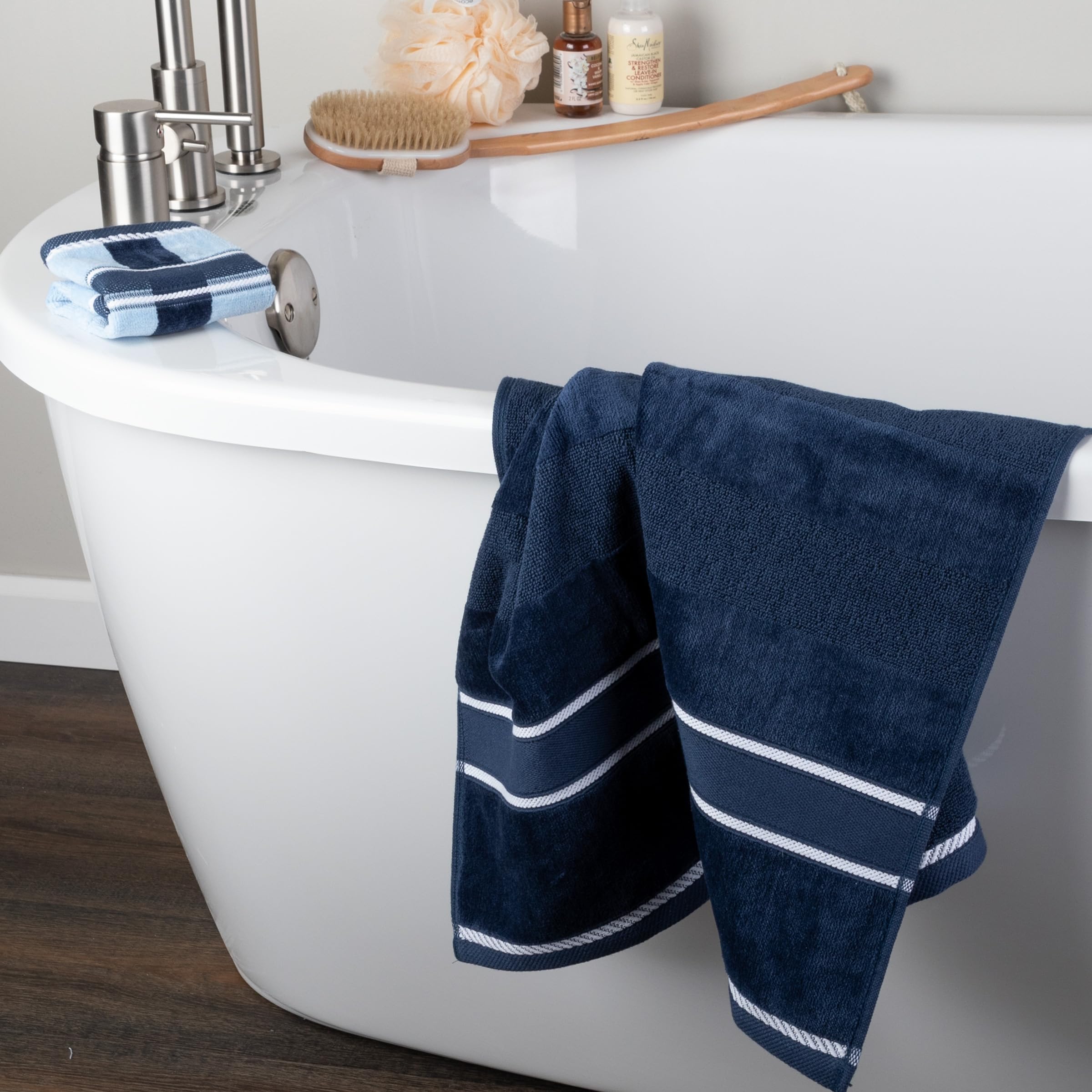 Lavish Home dorm bathroom with navy towels arranged for guest-ready spaces.