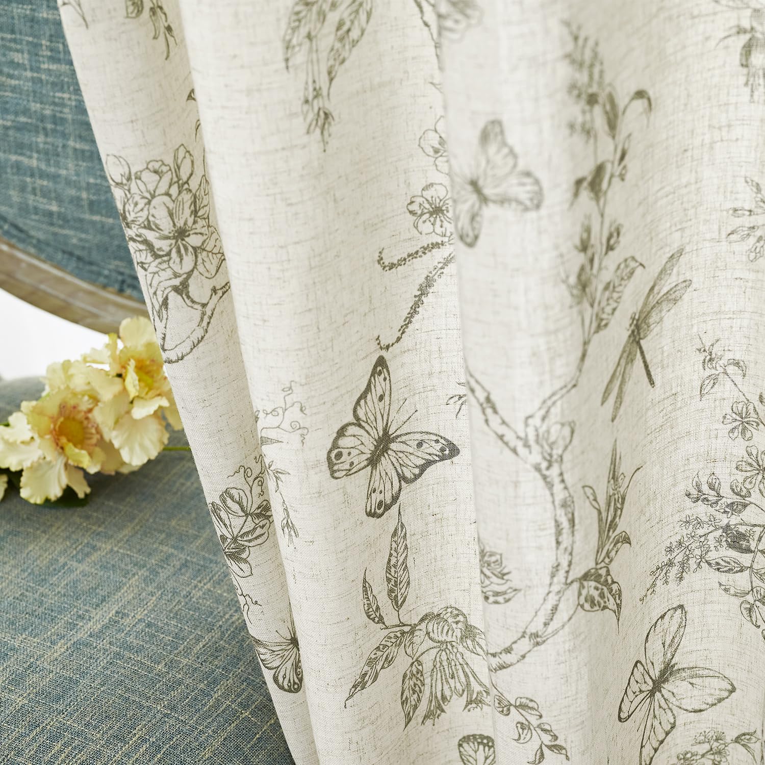 Lazzzy Charlotte linen blend curtains beside dining room with breeze flowing.