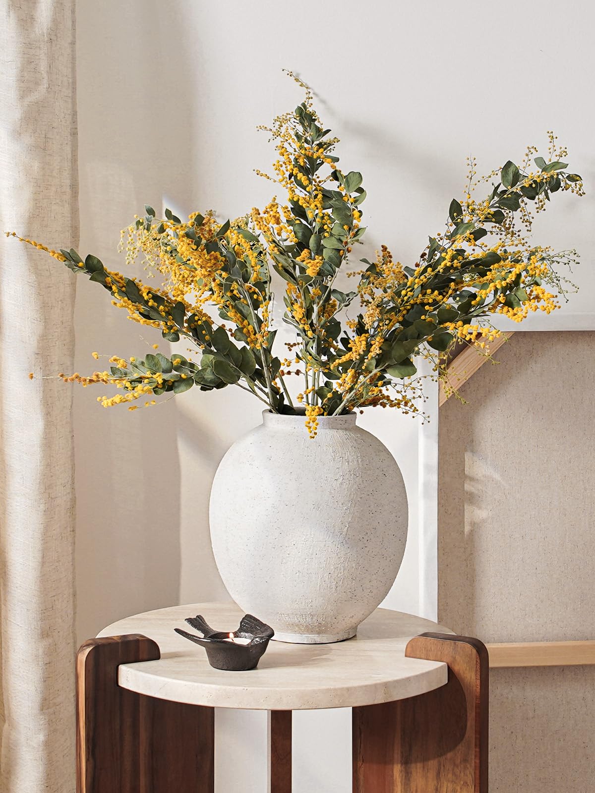 LE TAUCI GARDEN natural clay texture vase adds rustic warmth to shelves.