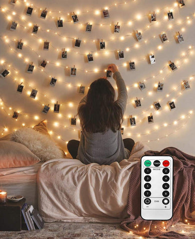 LECLSTAR 50-LED photo clips on a clear strand showcase memories with warm illumination.