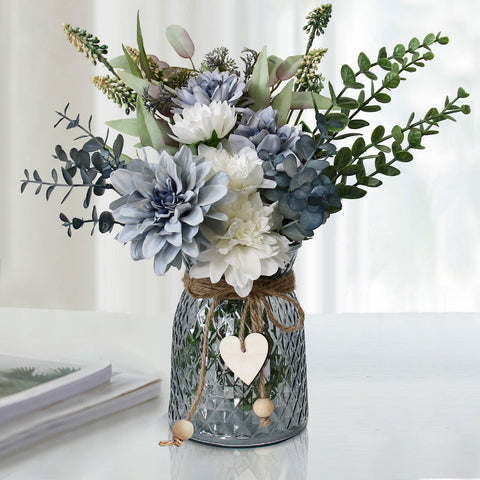 Leftover fake flowers in vase with dahlia bouquet for elegant table decor