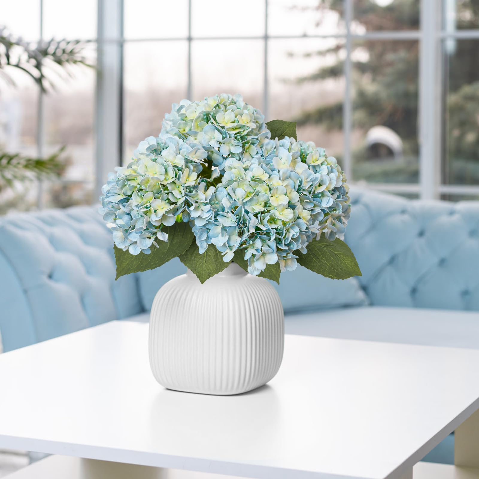 Leftover hydrangea faux flowers brighten living room decor with easy care.