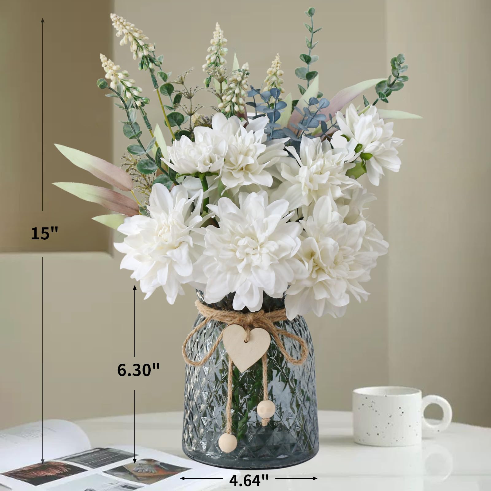 Leftover silk flowers and eucalyptus stems in a black glass vase for elegant decor