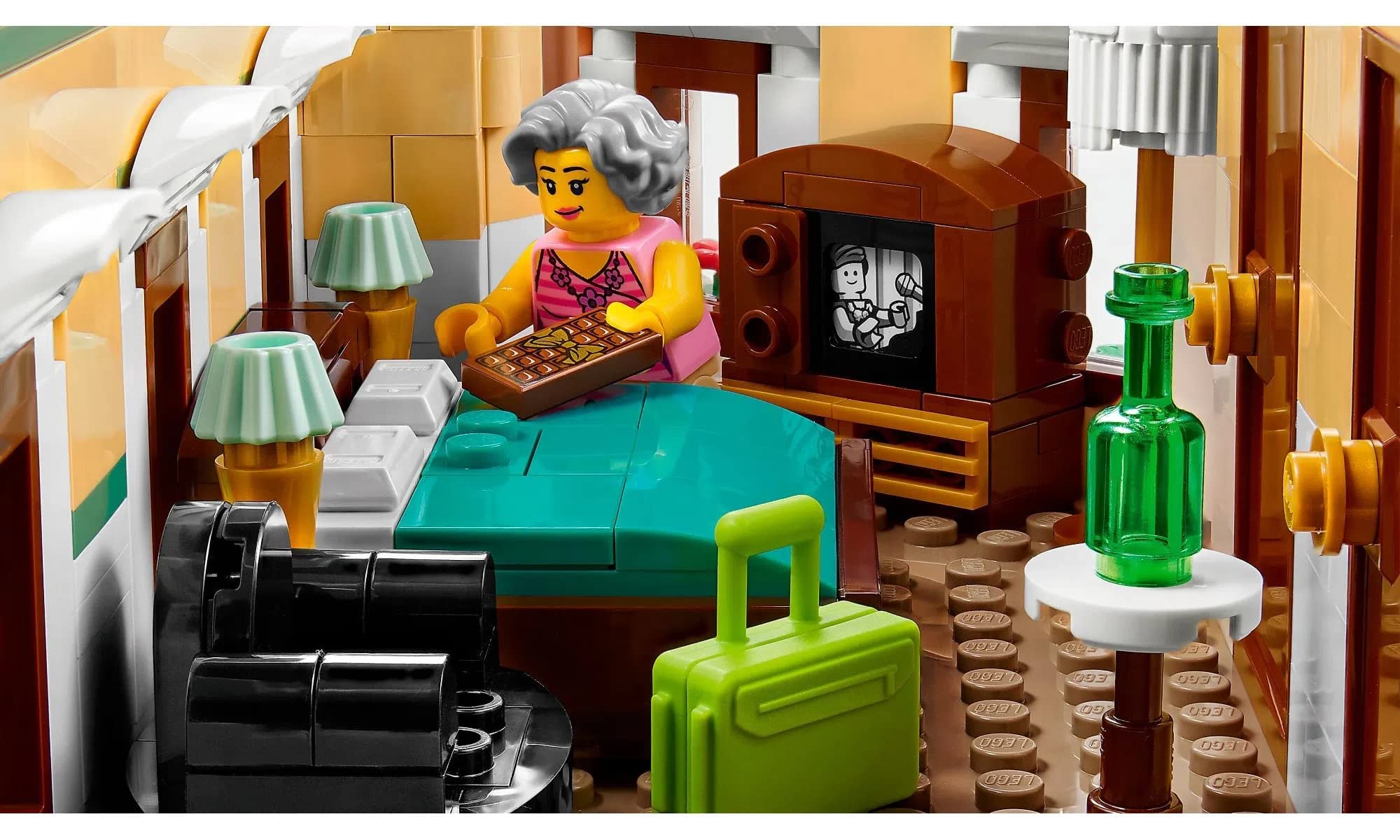 LEGO Icons Boutique Hotel coffee cart with minifigures, storytelling vignette.
