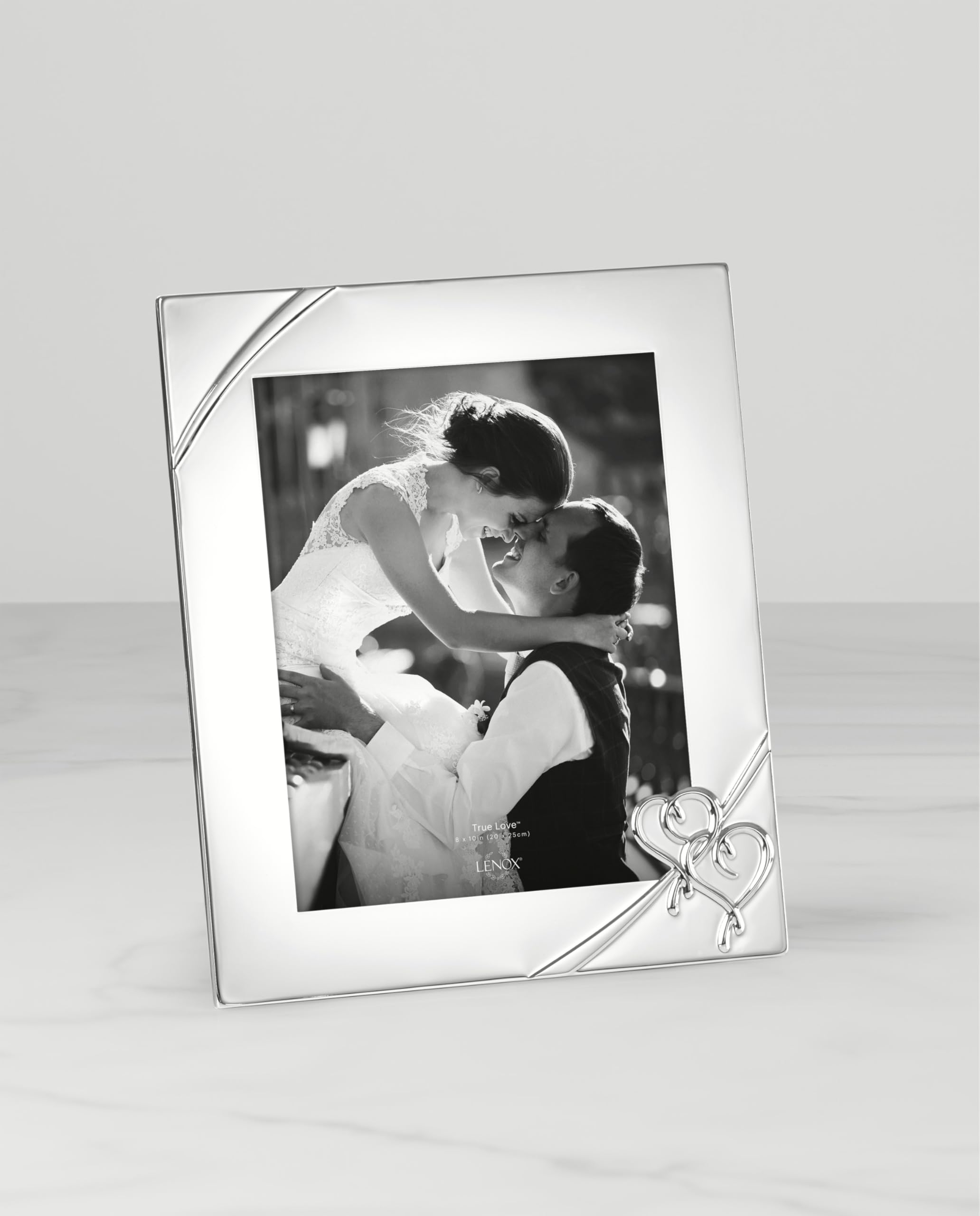 Lenox silver-plated zinc alloy finish enhances treasured photos.