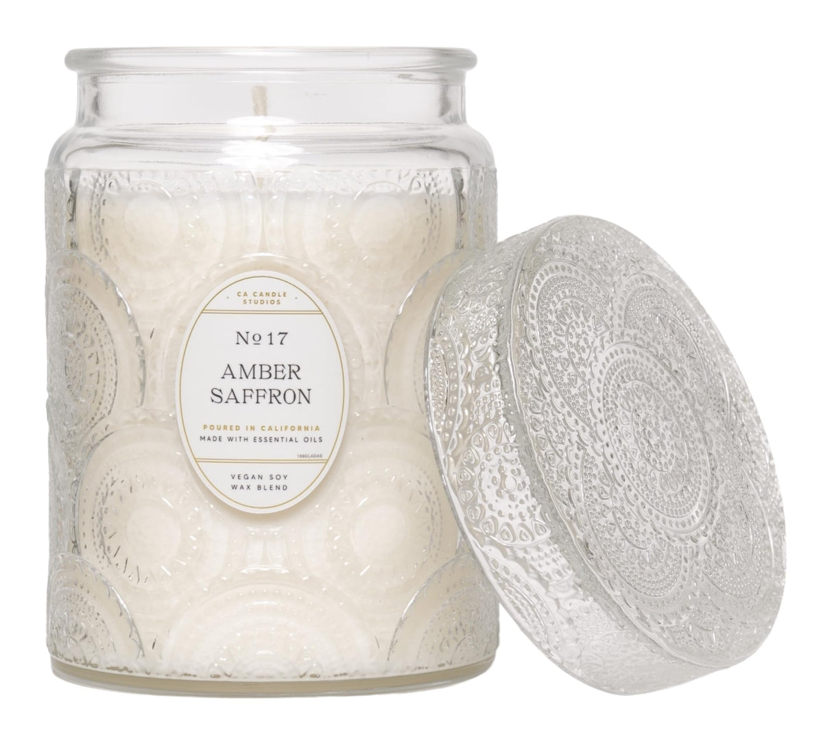 LEOBEN COMPANY amber saffron candle with embossed jar enhances elegant ambience.