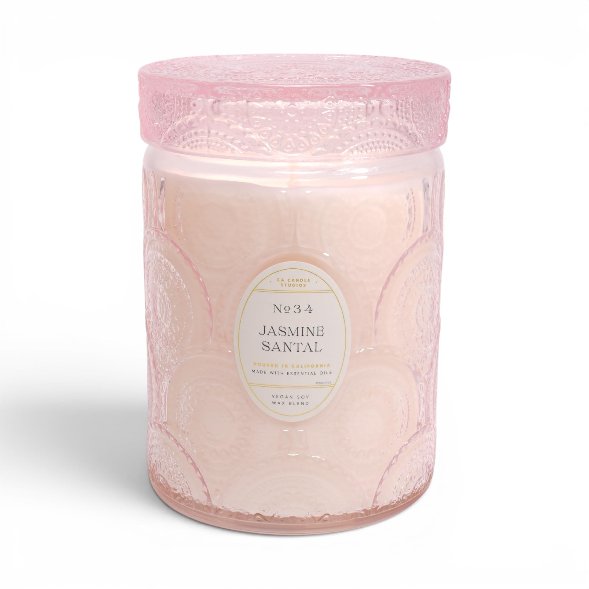 LEOBEN CO Jasmine Santal candle in embossed jar creates elegant ambiance in any room.