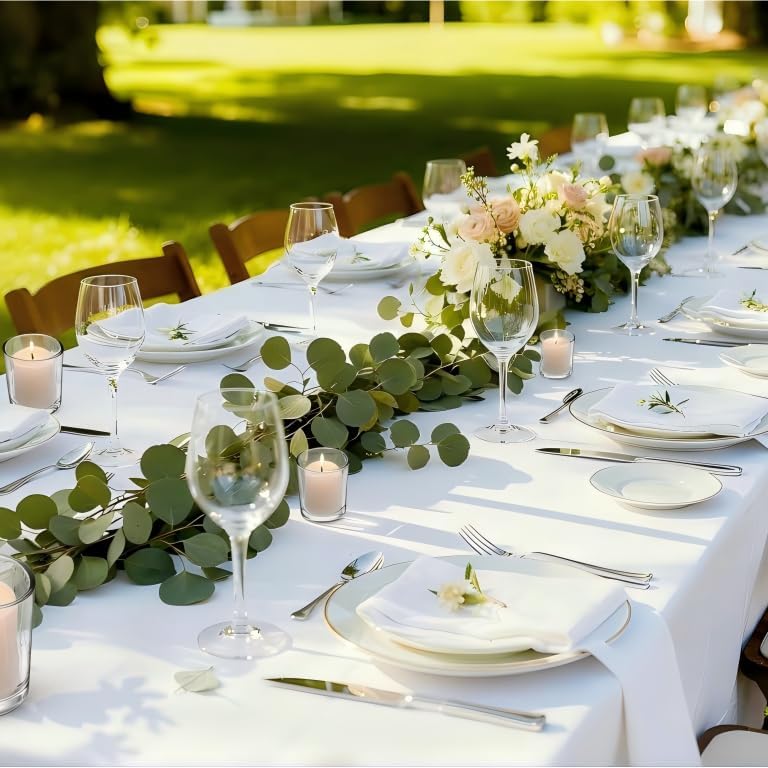Letine centerpieces with glass votive holders enhancing festive event ambiance.