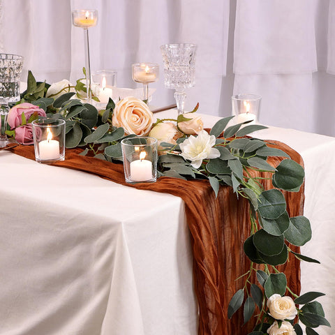 Letine wedding centerpiece votive holder on a table with warm glow.