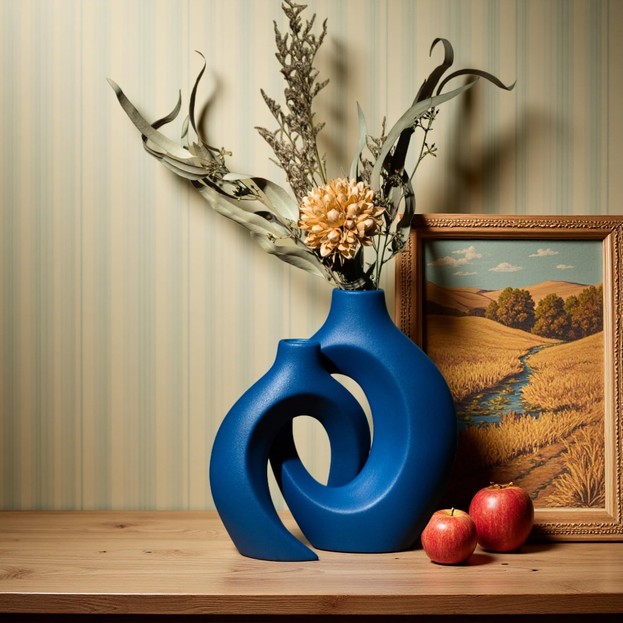 Levvohd Snuggle Hollow navy vase adds a modern boho touch.