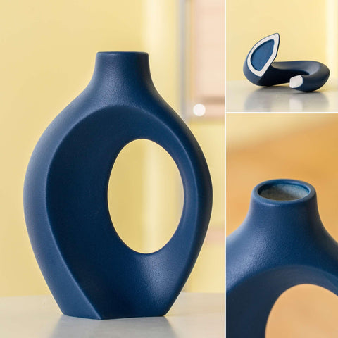 Levvohd Snuggle Hollow navy vase features a textured glaze.