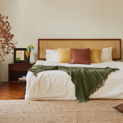 Lifein olive green throw on bed as stylish accent