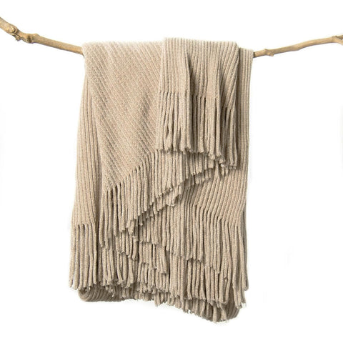 lifein throw blanket on couch offers cozy lounging and decor appeal.