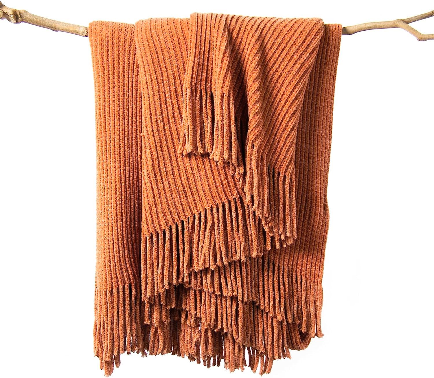 lifein throw blanket on couch in burnt orange offers cozy year-round comfort.