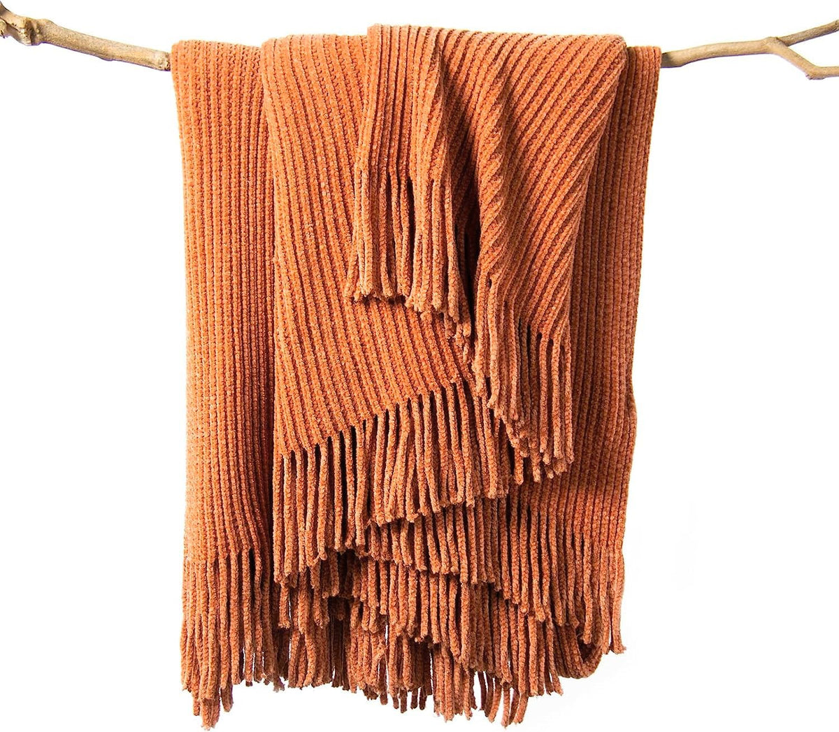 lifein throw blanket on couch in burnt orange offers cozy year-round comfort.