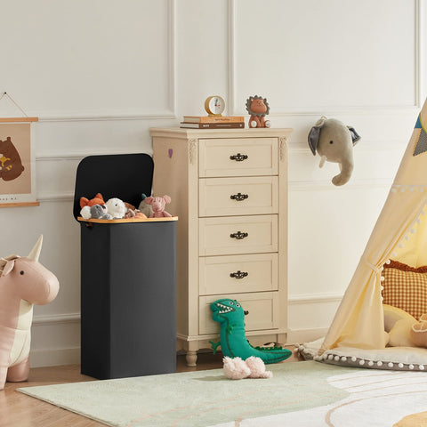Lifewit 100L basket in bedroom or dorm keeps laundry neat and contained.