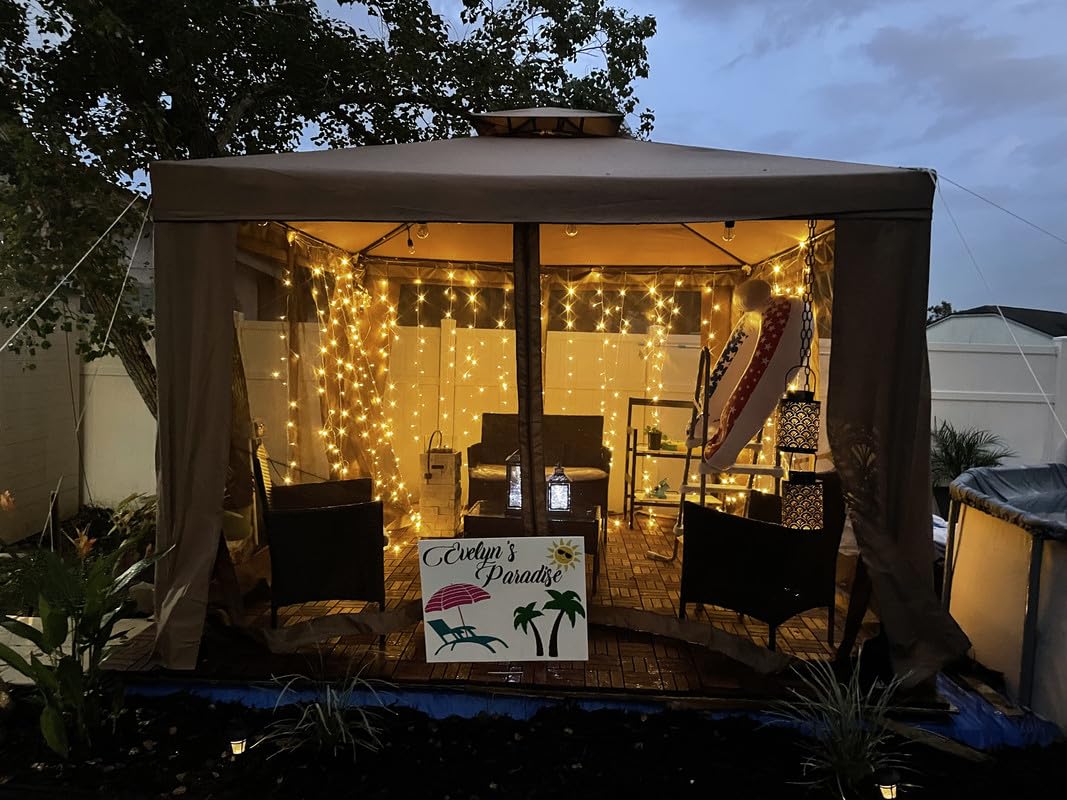 Lighting EVER LED curtain lights decorate gazebo and patio for outdoor events.
