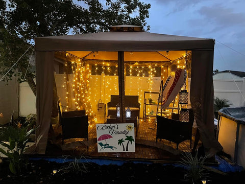 Lighting EVER LED curtain lights decorate gazebo and patio for outdoor events.