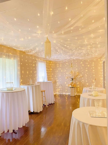 Lighting EVER LED curtain lights elevate tent scenery for parties.