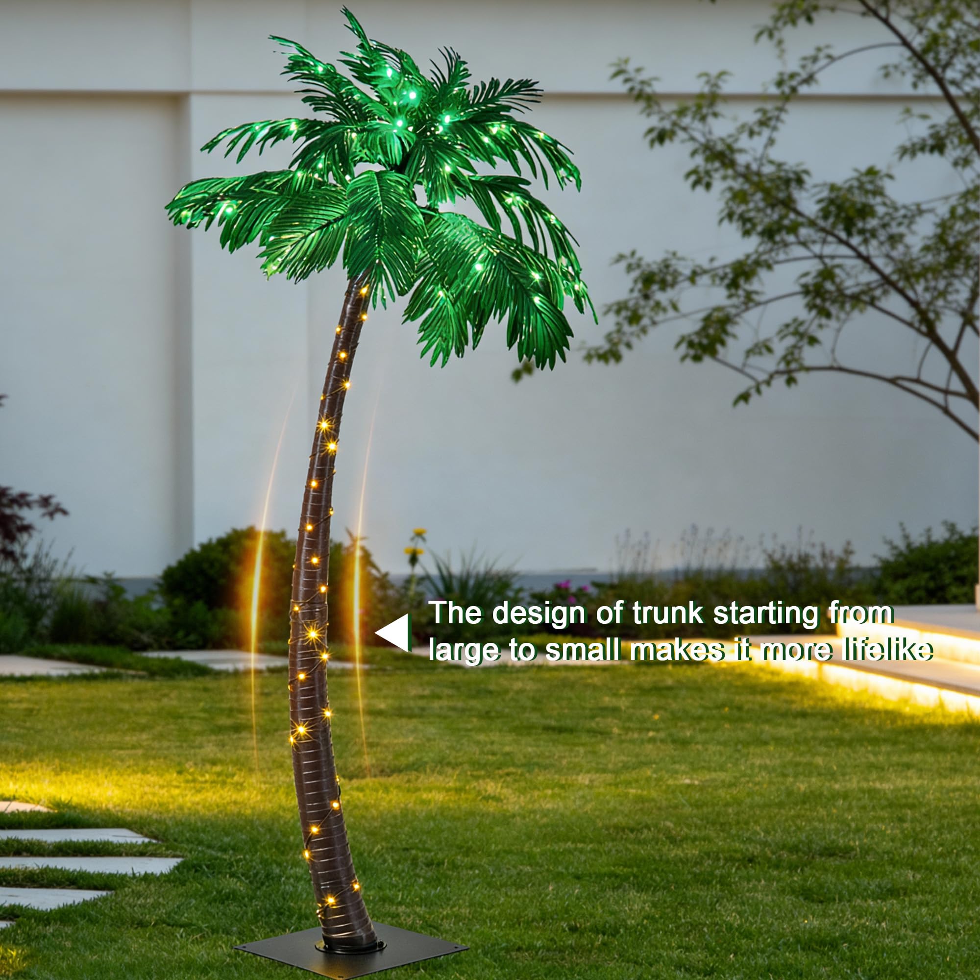 Lightshare palm tree with green LED leaves glowing at night.