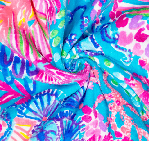 Lilly Pulitzer travel-friendly towel rolls compact for easy packing in totes or bags.