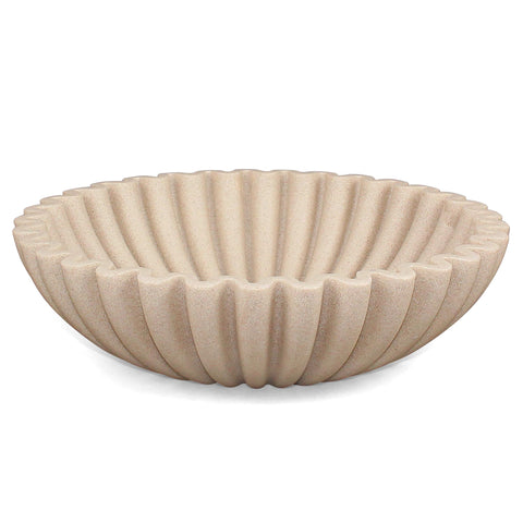 LIN CHUAN ruffle-edge bowl as a stylish countertop centerpiece.