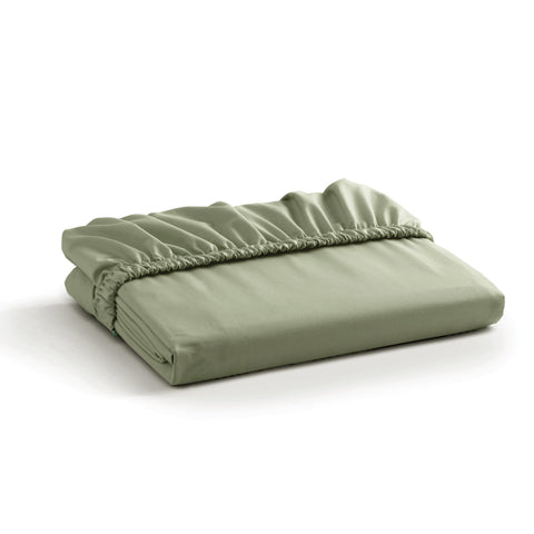 Linen Home sage-percale-fitted-sheet on bed delivers a crisp, cool sleep surface.
