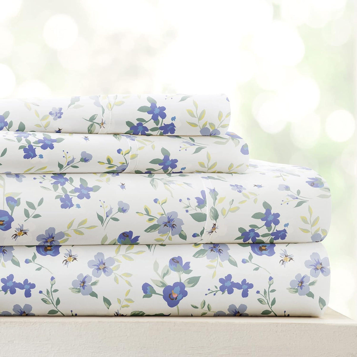 Linen Market Blossoms light blue cal-king sheets folded to brighten the bedroom