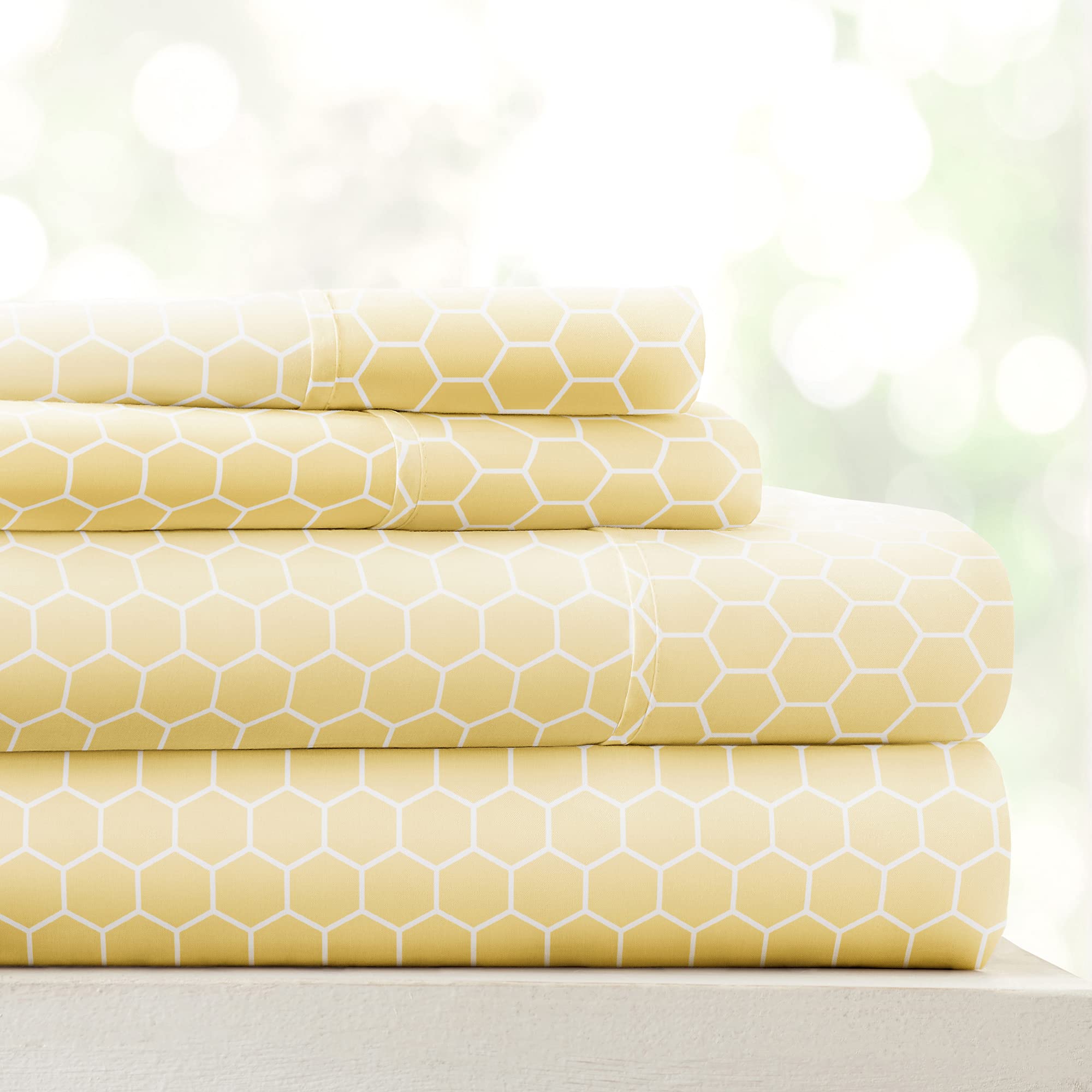 Linen Market honeycomb yellow patterned microfiber queen sheet set on bed, inviting and breathable