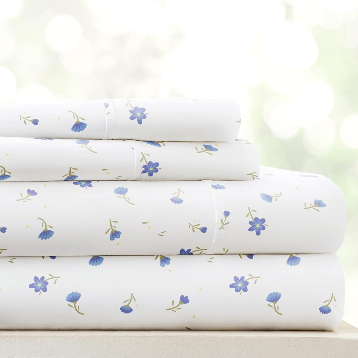 Linen Market soft floral light-blue sheets enhance a refreshing queen bed