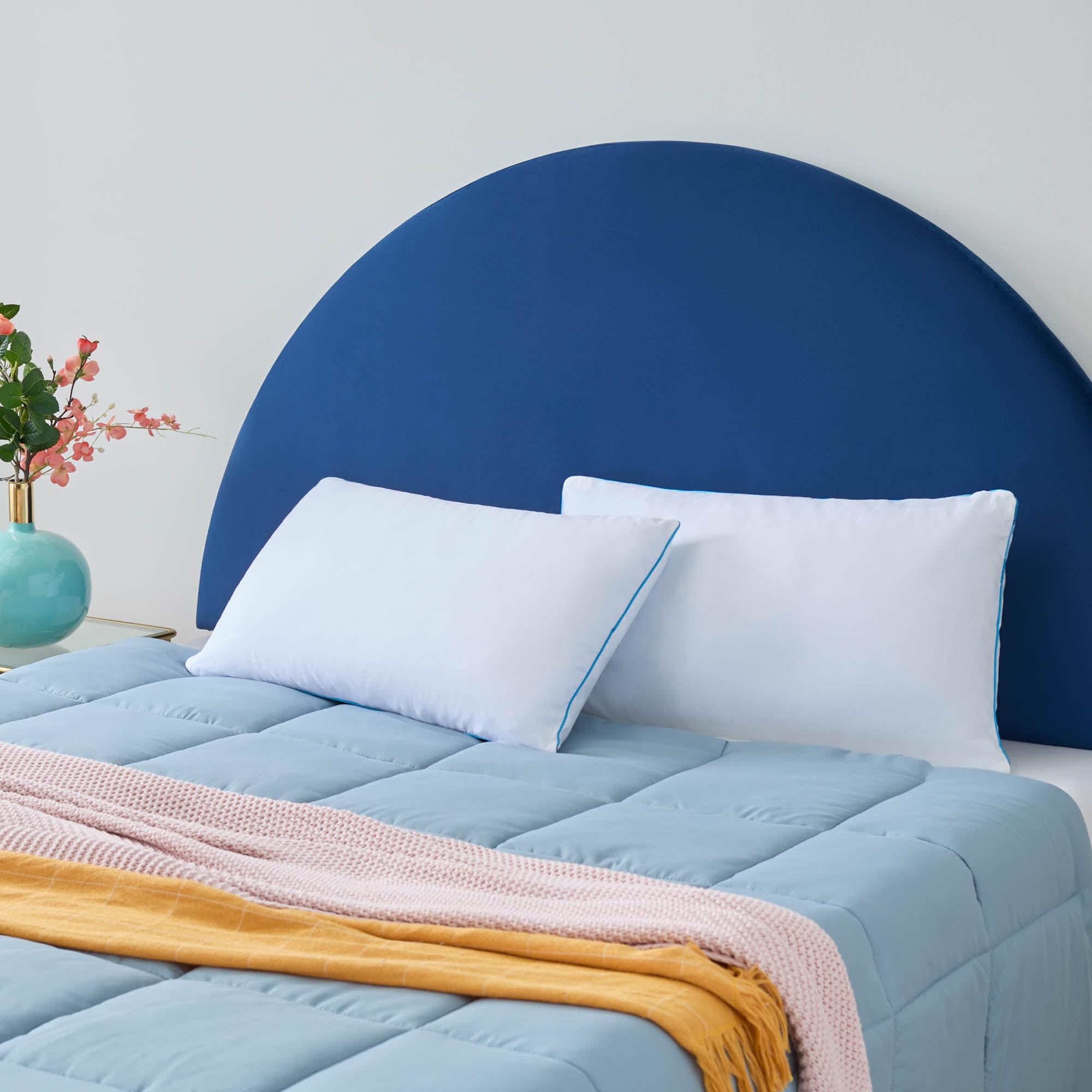 Linenspa two-pack pillow set ready for bed, delivering flexible support and cooling relief.
