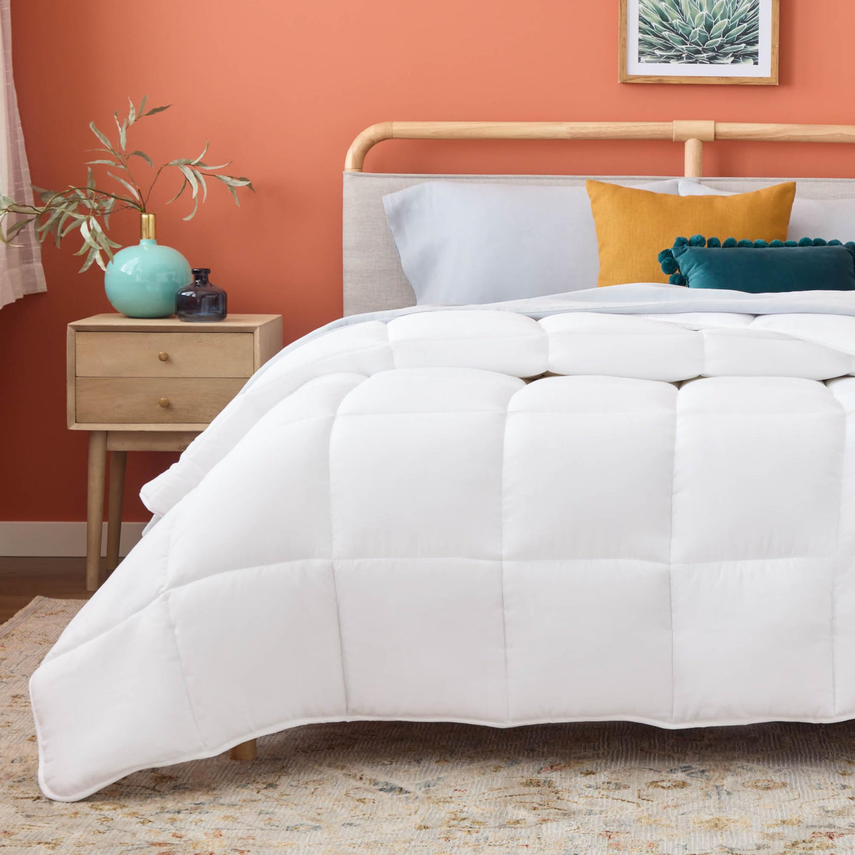 Linenspa white down-alternative comforter front view highlighting all-season warmth
