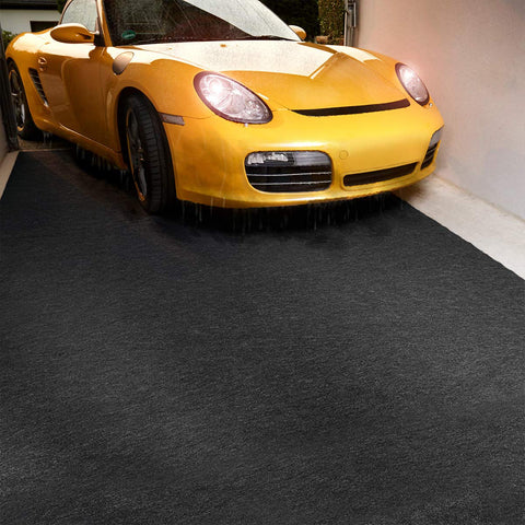LINLA mat placed under a motorcycle to prevent floor staining.