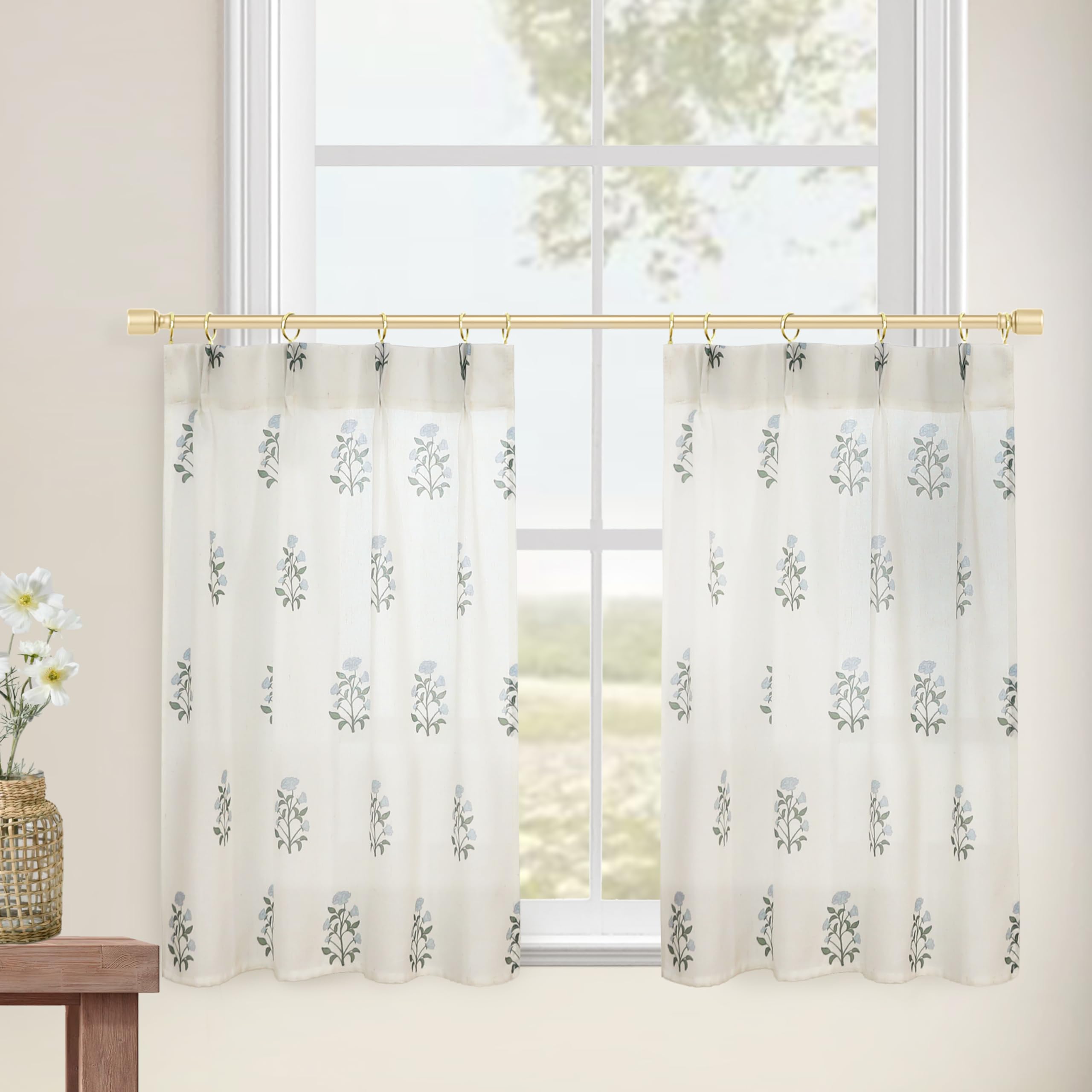 Blue-green vintage floral print by Lino Rosa adds timeless charm to a small window.