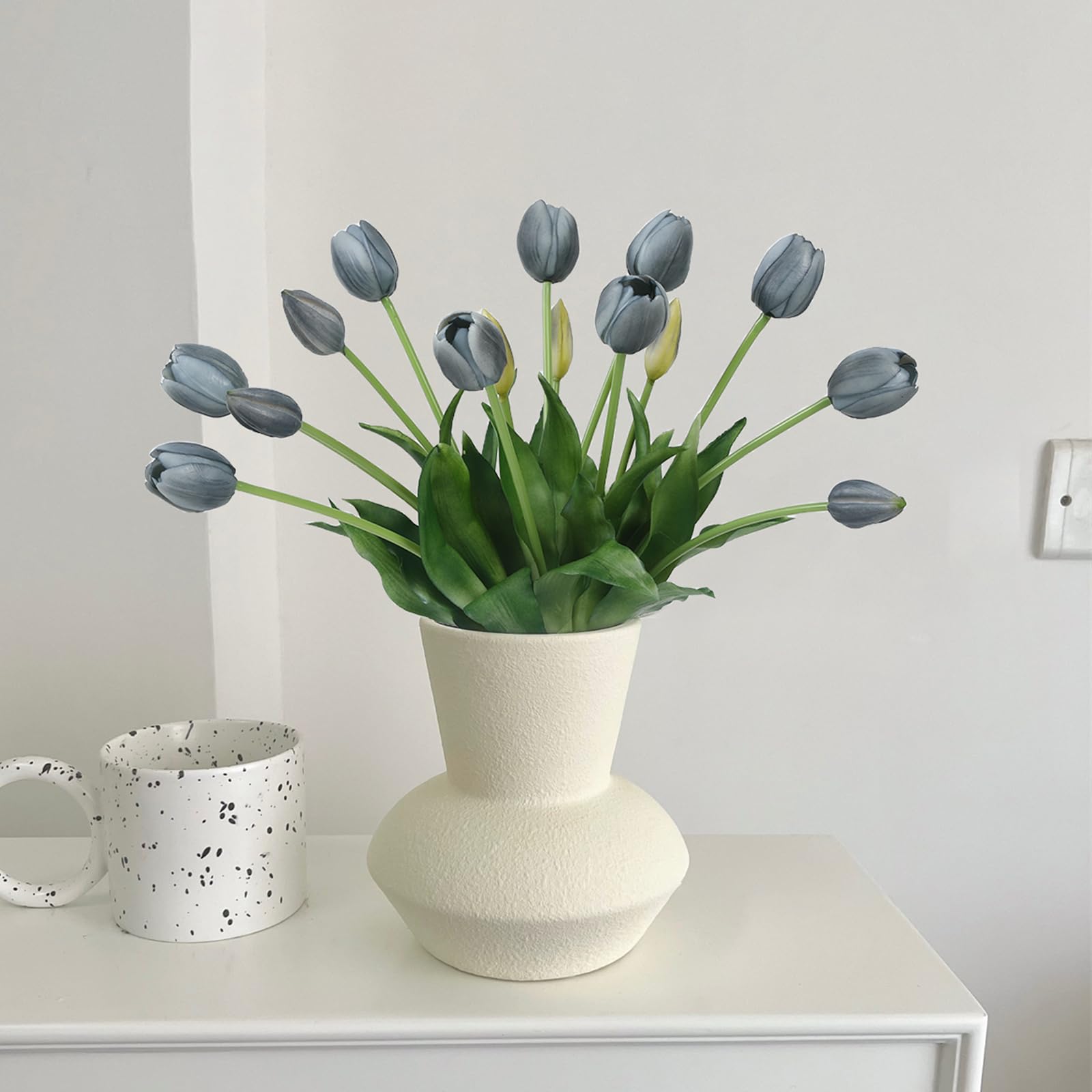 LINSIE orange tulips being wiped clean after an event to maintain brightness.
