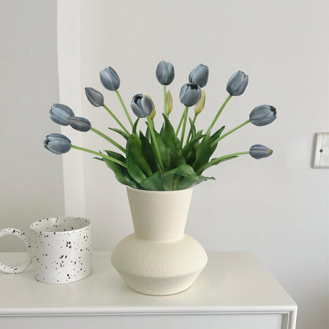 LINSIE orange tulips being wiped clean after an event to maintain brightness.