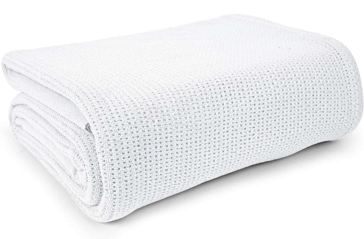 Linteum Textile Supply white hospital blanket close-up texture shows soft 100% cotton.