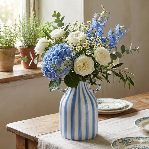 Compact vase suitable for bathroom counters or nightstands.