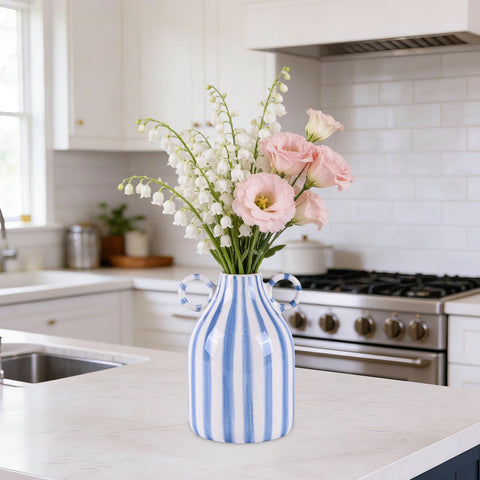 Jug-style vase with handle for easy relocation.