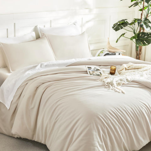 Litanika beige comforter texture close-up emphasizes soft, cloud-like fill and durable fabric.