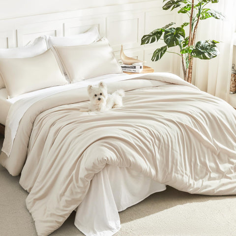 Litanika beige full-size comforter set on bed for lightweight, year-round warmth.
