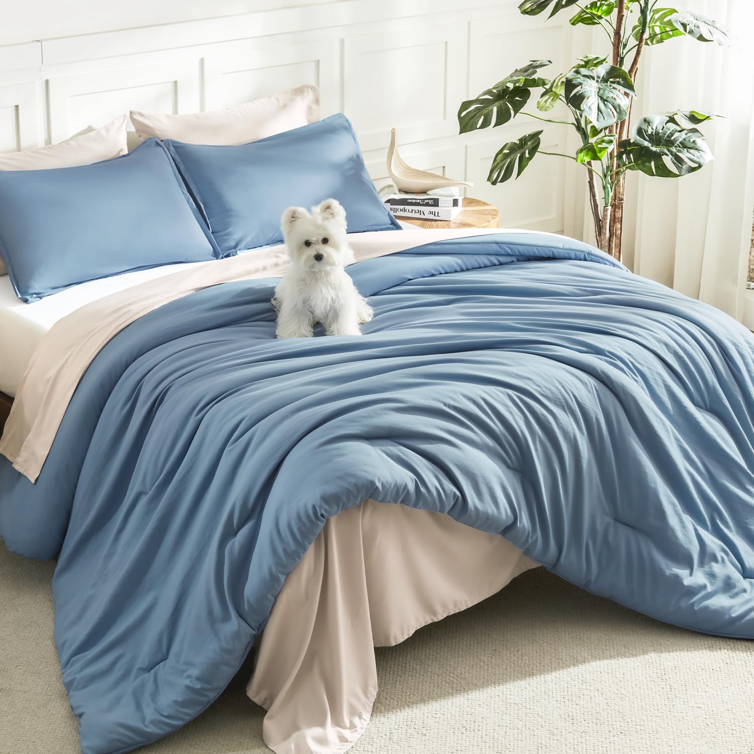 Litanika King comforter grayish blue on bed for all-season softness.