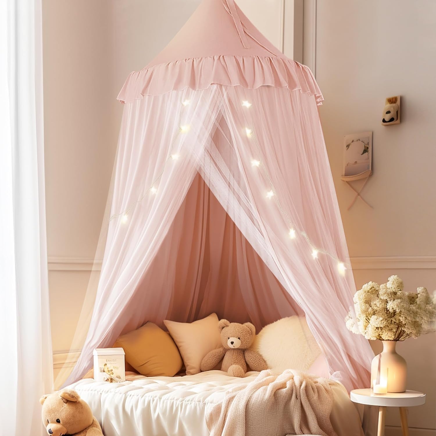 Little Dove bed canopy with star lights over a cozy pink bed for bedtime magic