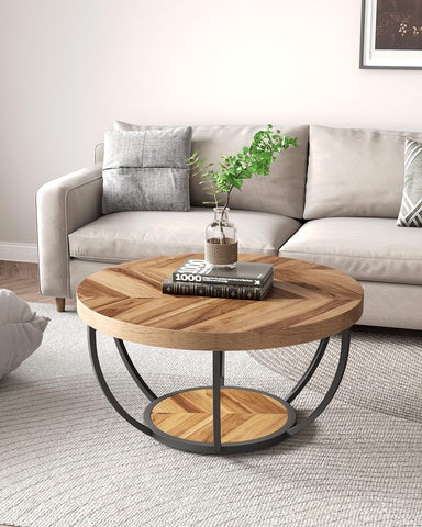 Little Tree round coffee table bottom shelf stores remotes and magazines neatly.