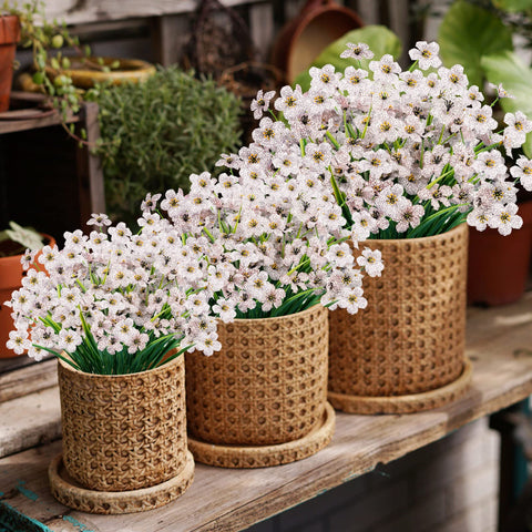 Lnoicy 24Pcs faux flowers on windowsill provide long-lasting decor.