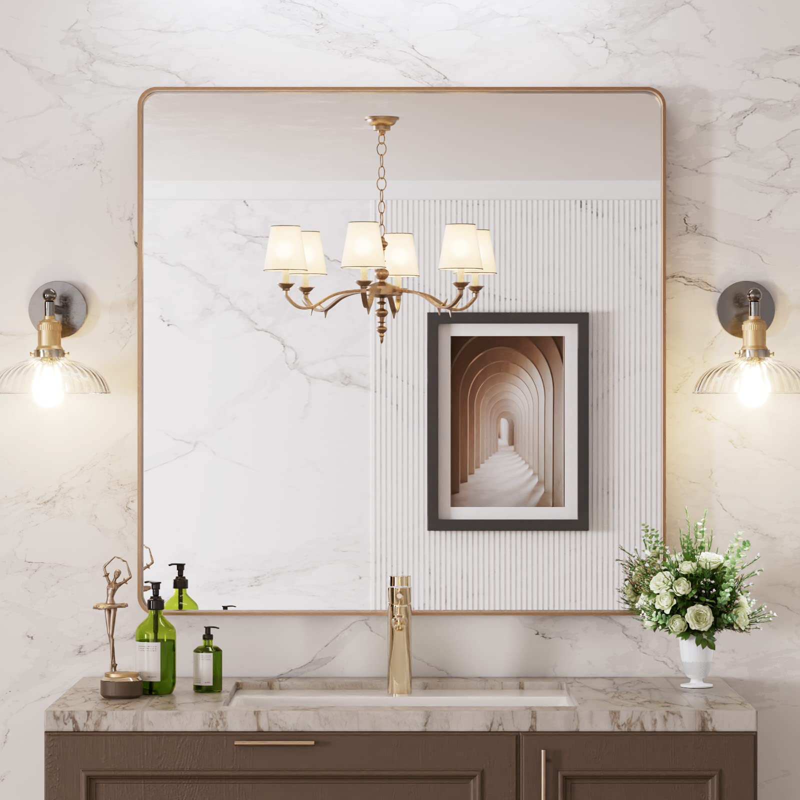 LOAAO gold bathroom mirror with rounded rectangle frame for clear reflections.