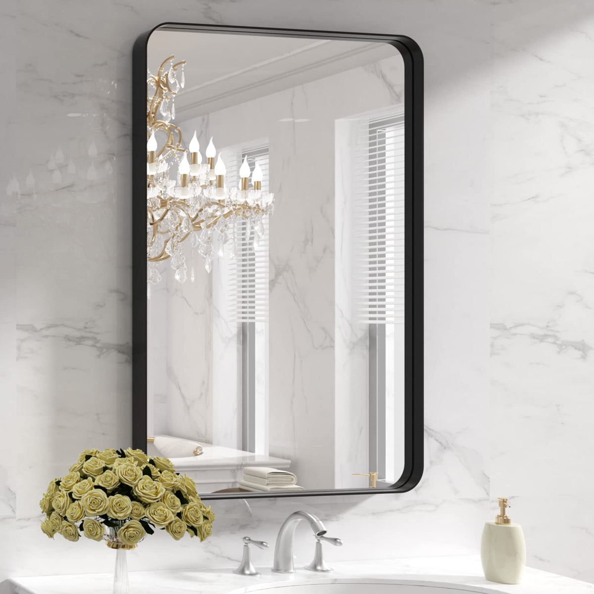 LOAAO black metal framed bathroom mirror with 24x36 inch clear reflection.